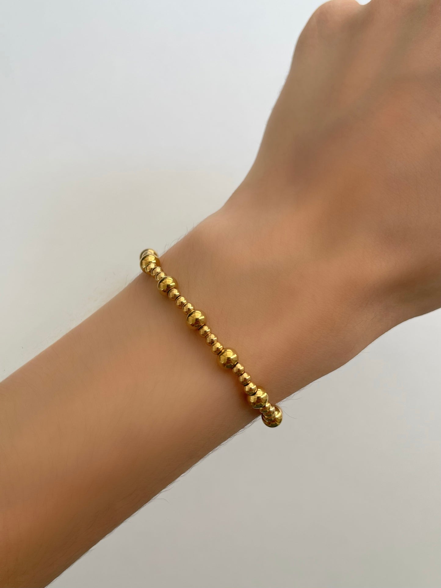 PULSERA BOLITAS DORADAS MIX