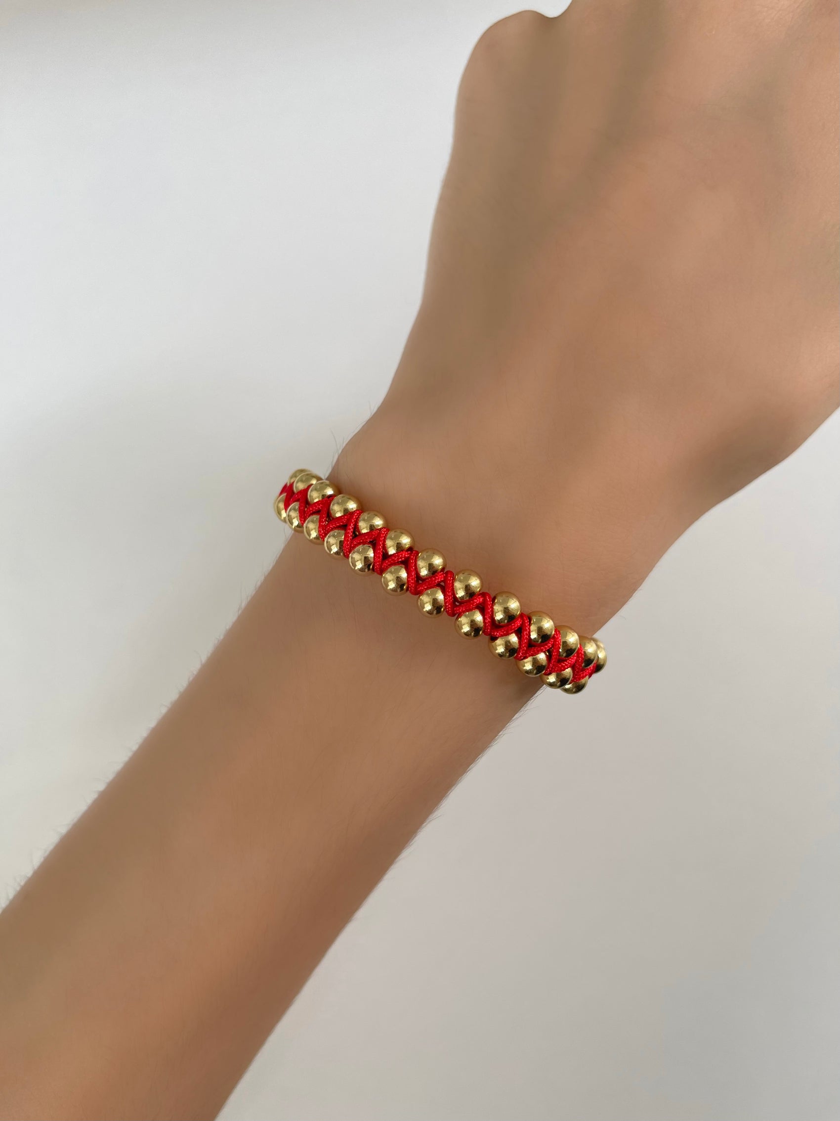 PULSERA BOLITAS HILO ROJO