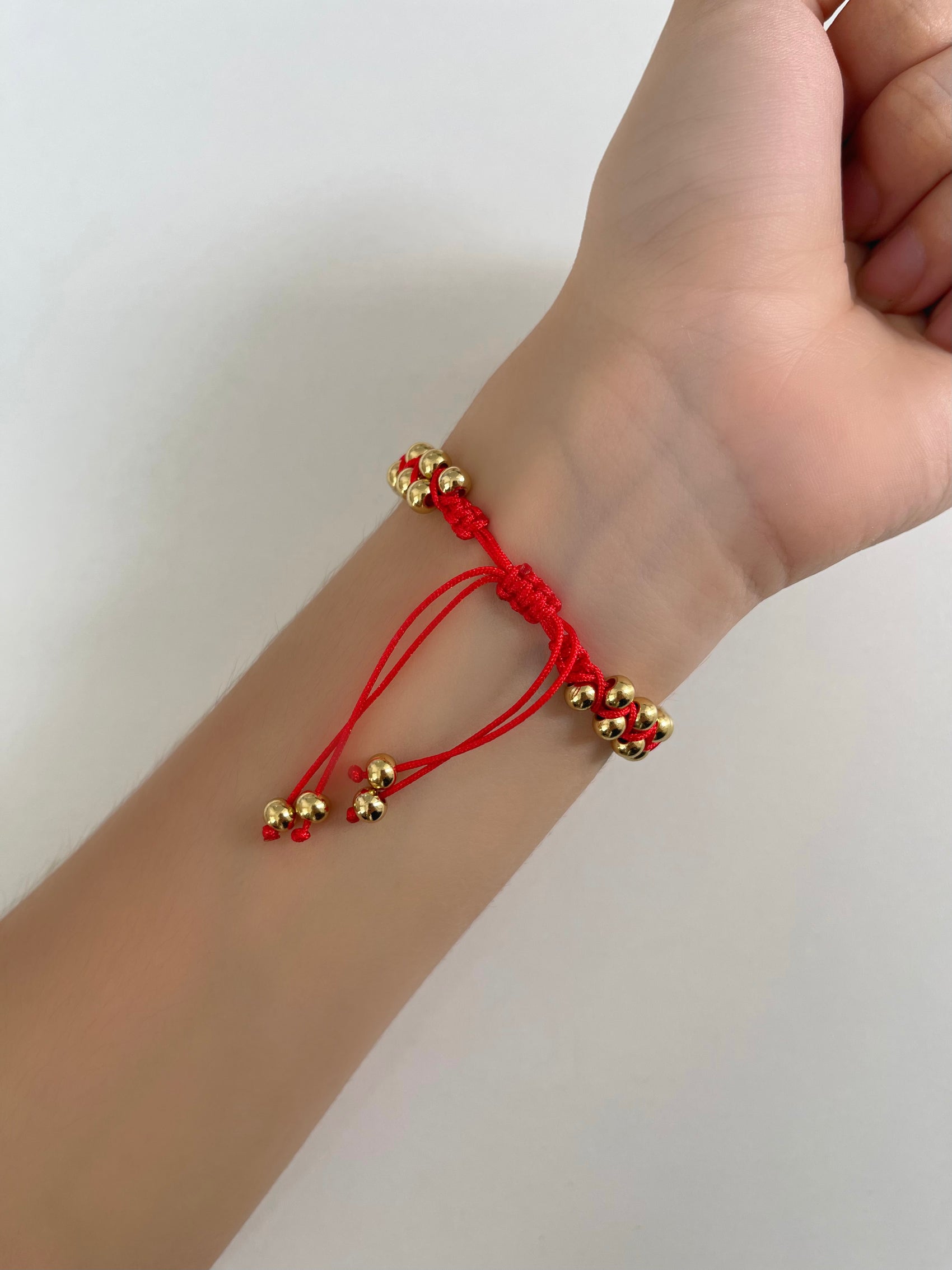 PULSERA BOLITAS HILO ROJO