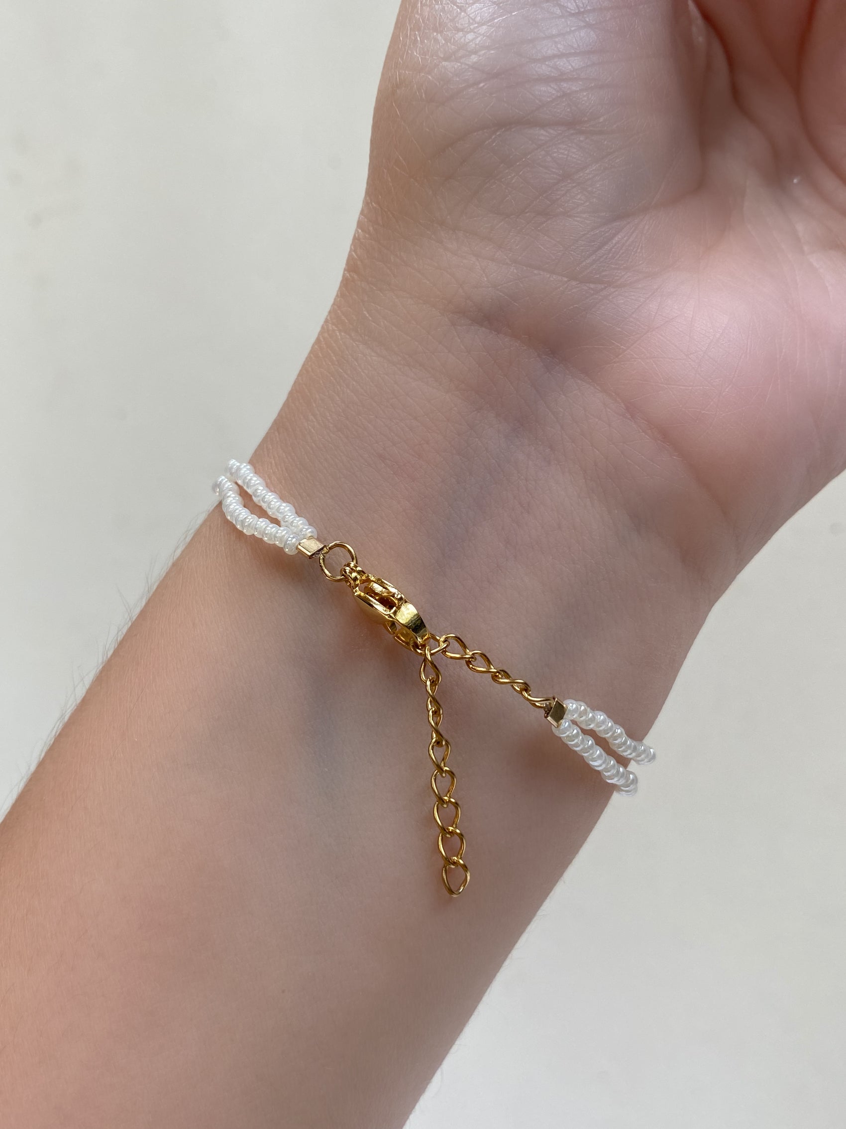 PULSERA NUDO CHAQUIRAS PERLA