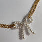 CHOKER DOBLE CON MOÑO PERLAS