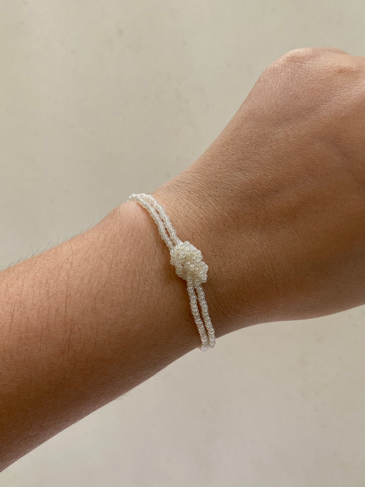 PULSERA NUDO CHAQUIRAS PERLA